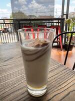 Iced Coffee with Milk in a Cafe Setting photo