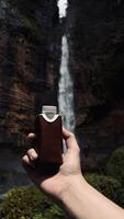Refreshing Drink by the Waterfall photo