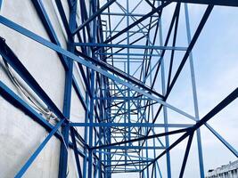 Blue Steel Framework Against Cloudy Sky photo