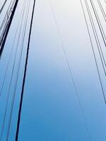 Artistic Minimalist Power Lines Against a Clear Blue Sky photo