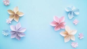Handmade Paper Flowers on a Soft Blue Background photo