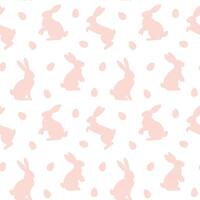 Seamless pattern with pink Easter bunnies and eggs on a white background vector