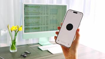 Prague, Czech republic - February 24, 2025. Close up view of hand holding Iphone with Chat Gpt application on screen. Work assistant with Open Ai. Artificial Intelligence concept. video