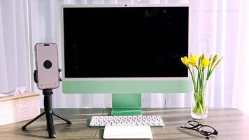 Prague, Czech republic - February 24, 2025. Work place with iMac and iPhone with open Chat Gpt application on screen. Work assistant with Open Ai. Artificial Intelligence concept. video