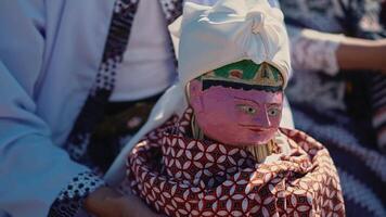 Traditional Doll Display with Colorful Textiles video