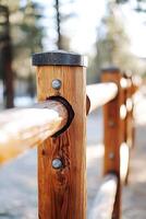 Close up view of wooden fence posts being installed in a natural environment photo