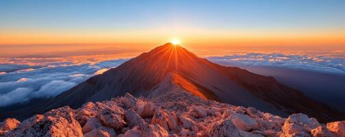 breathtaking golden sunset panorama over majestic mountain peaks and summit silhouettes photo