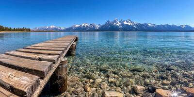 majestic mirrored magnificence, cerulean sky reflecting snow-capped peaks of crystal clear tetons photo