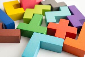 Logical thinking and problem solving problem solution creative business, wooden puzzle geometric block shape. photo