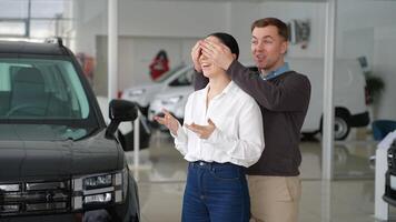 Man surprises woman with a new car at dealership video