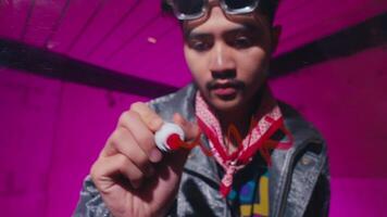 Young Man Writing on Glass with Vibrant Background video