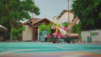 Dynamic Dance Pose on Cart in Outdoor Setting video