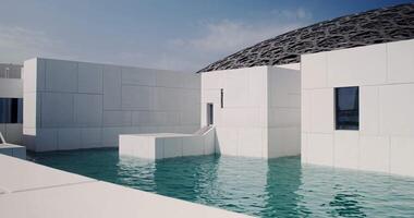 Abu Dhabi Art Museum in Dubai. Minimalistic white building, unusual architecture with a dome and a facade surrounded by water video