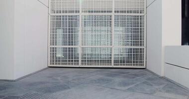 Louvre Abu Dhabi. A small lattice covering the window of a modern building. The facade of a minimalistic abstract structure video