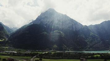 A scenic view of a valley and mountains with a lake video