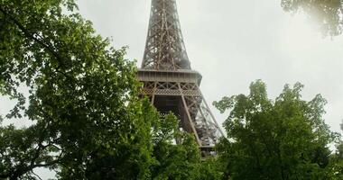 The eiffel tower is seen through the trees video