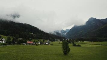 A view of a valley with a mountain range in the background video