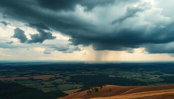 a stormy sky over a valley with a rain cloud photo
