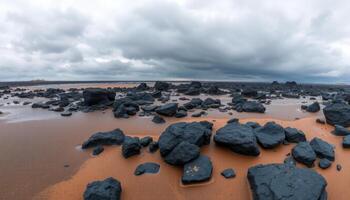 Panoramic View Of Dark Volcanic Rocks On A Stormy Beach photo