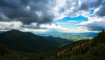 Dramatic Mountain Landscape with Distant City Under a Partly Cloudy Sky photo