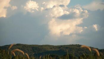 Dramatic Cloudy Sky Over Rolling Hills photo