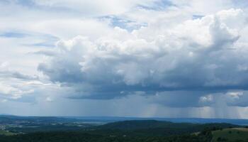 Dark Cumulus Clouds Over Lush Green Hills photo