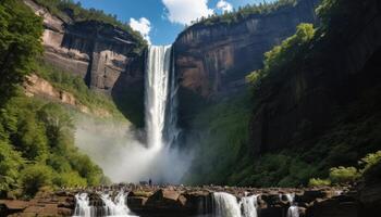 Massive Waterfall Cascading Down Mountainous Terrain photo