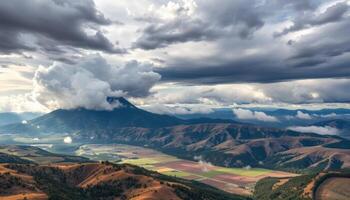 High Altitude View Of Mountain Valley And Storm Clouds photo