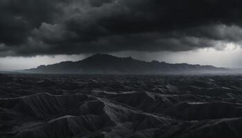 Dramatic Landscape of Dark Mountains Under Ominous Stormy Sky with Heavy Clouds photo
