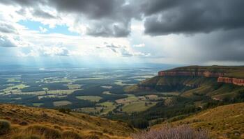 Panoramic Valley View From Mountaintop Under Stormy Sky photo