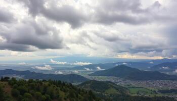 Panoramic Mountain View with Cloudy Sky and Valley photo