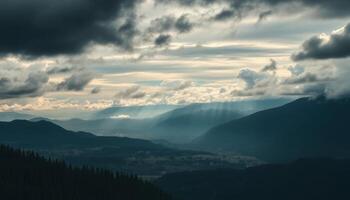 Moody Mountain Landscape with Sunbeams Piercing Through Clouds photo