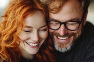 Couple sharing joyful moment with smiles in cozy indoor setting during daylight hours photo