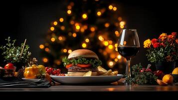 delicious hamburger on white plate, surrounded by fresh vegetables, fries, and glass of red wine, set against festive background with Christmas tree photo