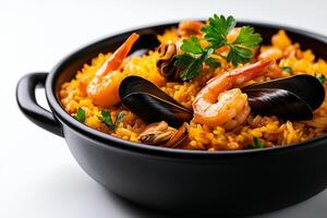 black bowl filled with vibrant yellow paella featuring shrimp and mussels, garnished with fresh parsley, creating delicious and inviting dish photo
