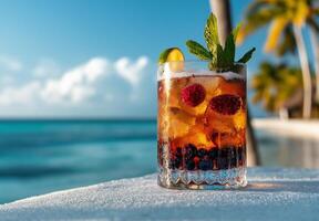 colorful cocktail with ice cubes, blueberries, and raspberries, garnished with mint, set against tropical beach backdrop. Perfect for summer relaxation photo