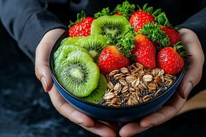 colorful and vibrant smoothie bowl filled with fresh strawberries, kiwi slices, and granola, showcasing healthy and delicious meal photo