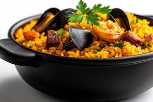 black bowl filled with vibrant yellow paella, featuring shrimp, mussels, and garnished with fresh parsley, evokes sense of culinary delight and warmth photo