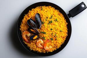 black bowl of yellow rice with shrimp and mussels, garnished with herbs, creates vibrant and appetizing dish. seafood adds touch of elegance to meal photo