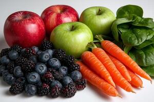 Fresh apples, green apples, spinach, blueberries, blackberries, carrots create vibrant display of healthy fruits and vegetables, perfect for nutritious meal photo