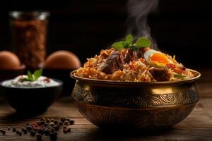 Aromatic chicken biryani with eggs, garnished with mint leaves, served in traditional bowl. dish is steaming, showcasing its rich flavors and spices photo
