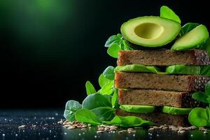 Fresh whole grain bread slices stacked with avocado and leafy greens, creating healthy and vibrant composition. Perfect for nutritious meal or snack photo
