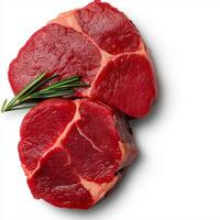 Fresh raw beef steaks with rosemary on white background showcasing rich red color and marbling. Perfect for culinary presentations and recipes photo