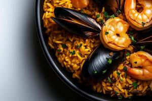 Saffron rice with mussels and shrimp in black bowl, garnished with parsley, creates vibrant and appetizing dish. rich colors and textures evoke sense of culinary delight photo