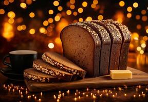 Freshly baked loaf of bread with sliced pieces and butter, set against warm, glowing background. Perfect for breakfast or cozy snack photo