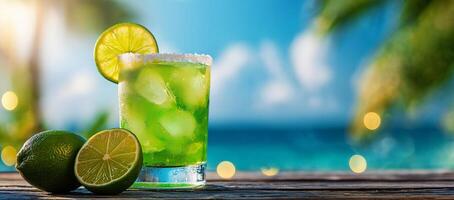 Refreshing cocktail with lime and salt, set against tropical beach backdrop. vibrant green drink is garnished with lime slice, evoking sense of relaxation and summer vibes photo