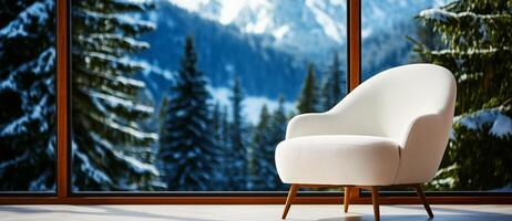 cozy white armchair in modern room with stunning snowy mountain view. large windows frame serene landscape, creating peaceful atmosphere photo
