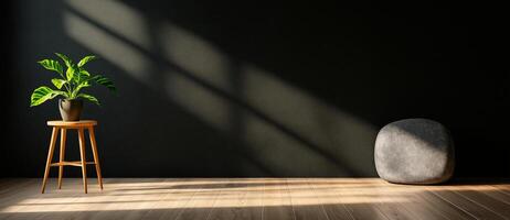 minimalist room featuring potted plant on wooden stool, with smooth stone on floor and soft shadows cast by sunlight. dark wall enhances serene atmosphere photo