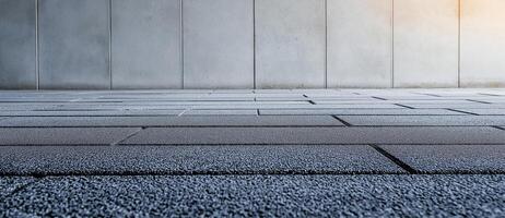 modern concrete wall with textured floor, creating industrial atmosphere. scene evokes sense of minimalism and simplicity, perfect for various design projects photo