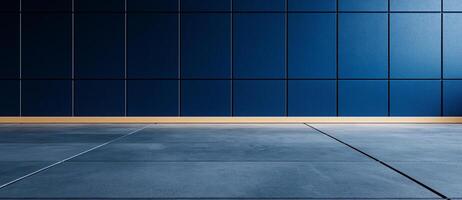 Modern empty room with blue concrete wall and gray asphalt floor. clean lines and minimalist design create calm and spacious atmosphere, perfect for various uses photo